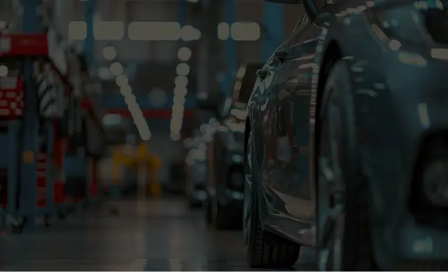 Blurred automotive workshop background with car on lift